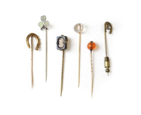 A group of six stick pins, a French gold diamond and seed pearl crescent moon stick pin,with a crescent of graduated rose cut