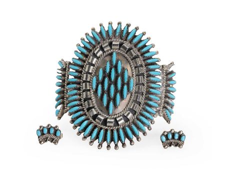 A Navajo silver and turquoise cuff bangle and a pair of earrings, the open bangle set throughout with navette shaped turquois