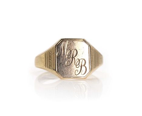 A 9ct gold signet ring, with a rectangular head, engraved 'M R B', into tapered machine engraved shoulders and a D profile sh