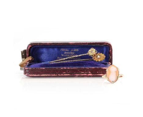 Two Victorian stick pins and a cameo ring, comprising a Victorian split pearl stick pin, stamped 15ct, a Victorian split pear