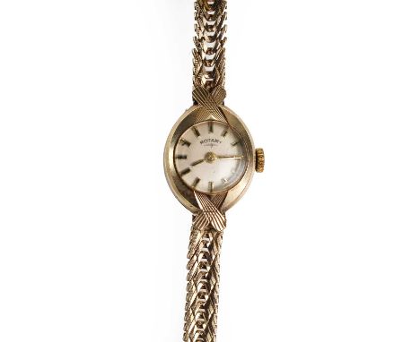 A ladies' 9ct gold Rotary mechanical bracelet watch, with an oval case with engraved crossover detail, 23mm x 14mm, a silvere