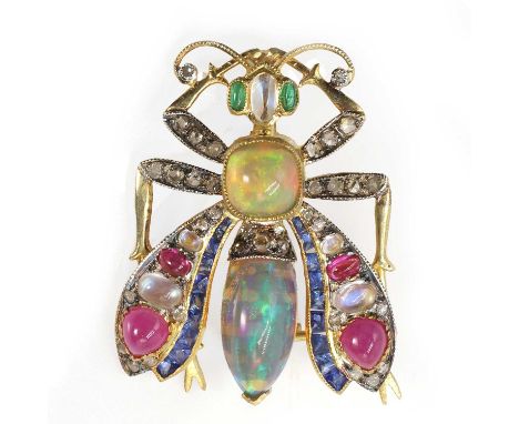 A gemstone set articulated winged beetle brooch, the head with cabochon moonstone and emerald, the thorax featuring a cushion