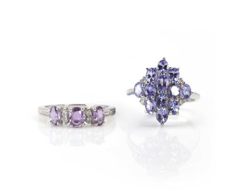 A 9ct white gold tanzanite cluster ring and a 9ct white gold pink sapphire ring, a 9ct gold tanzanite and diamond cluster rin