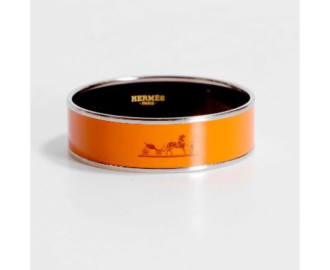 A Hermes orange bangle, marked 'HERMES, Paris, and Made in France, to the inner, with original box, inner dimensions 6cm