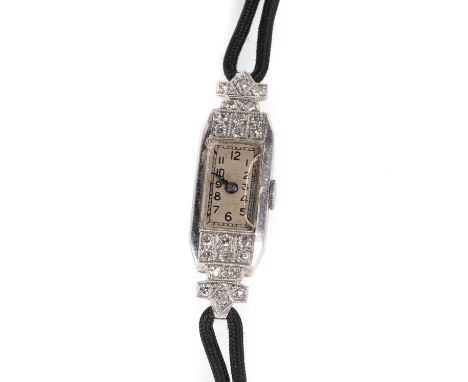An Art Deco diamond cocktail strap watch, with a rectangular case, 39mm x 11mm, grain set with eight cut diamonds, a silvered