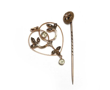 An Edwardian chrysolite and split pearl pendant and a split pearl stick pin, the heart shaped pendant with a central round cu