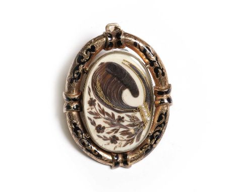 An enamel mourning pendant, a central glazed panel enclosing hair work, split pearls and wire work, to an engraved champlevé 