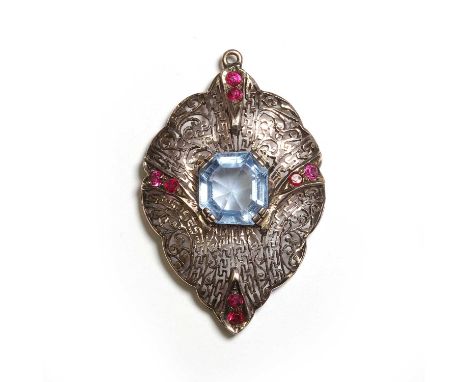 A synthetic blue spinel and synthetic ruby pendant, with a rectangular cut synthetic blue spinel, claw set to an elaborately 