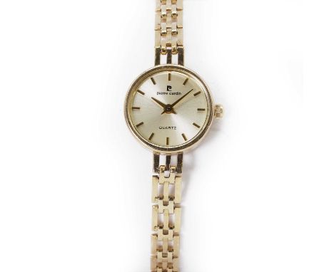 A ladies' 9ct gold Pierre Cardin quartz bracelet watch, with a 17mm diameter case, a gilt dial, gilt baton hour markers, gilt