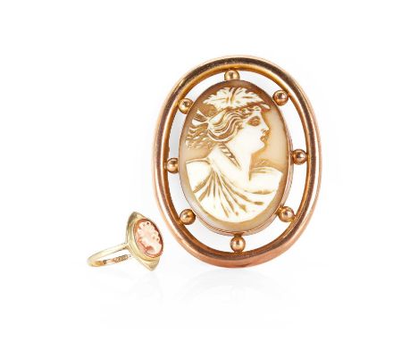 A shell cameo brooch and a shell cameo ring, the brooch with an oval shell cameo depicting a lady in profile facing right, be