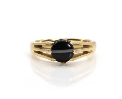 A banded agate single stone ring,  with a round banded agate cabochon, claw set to trifurcated shoulders and a D profile shan