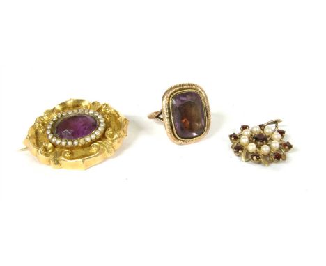 A gold amethyst and split pearl brooch , an oval mixed cut amethyst, rub set to single row of split pearls, to a scrolling fr