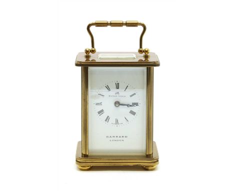 A Matthew Norman brass cased carriage clock, retailed by Garrard of London, 14cm to top of handle
