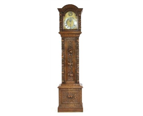 A tall 19 th century carved oak longcase clock, by George Farrer, Tunbridge Wells, with subsidiary seconds and strike/ silent