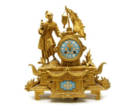 A French style gilt metal mantel clock, with blue enamel dial and Oriental female surmount, movement marked E. Pannard, 41cm 