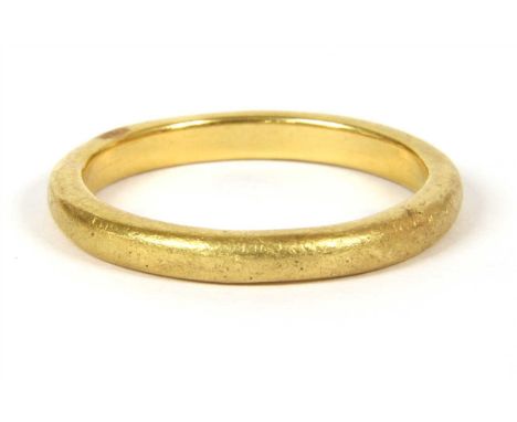 A gold wedding ring, marked 22ct, Tested as approximately 22ct gold, size U, 6.74g