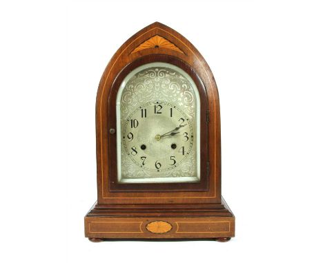A George III style inlaid mahogany lancet clock, with satinwood an ebony inlay, the silvered dial with chased decoration and 
