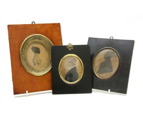 A 19th Century portrait miniature, depicting a gentleman in profile, within an ebonised frame, together with two similar silh