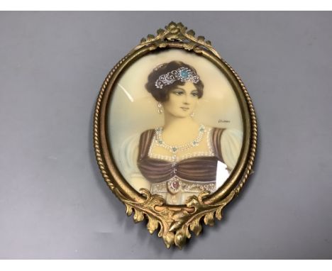 A portrait miniature of a lady, in a brass frame