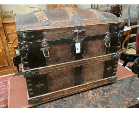 A late Victorian leather and metal mounted dome top trunk with scrap-work interior, length 76cm, depth 48cm, height 62cm