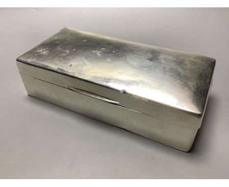 A George V silver mounted rectangular cigarette box, Birmingham, 1929, 19.3 cm.