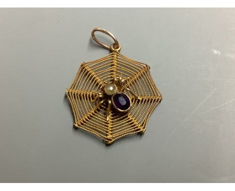 A 9ct, amethyst and seed paerl set 'spider in web' pendant,22mm, gross 1.1 grams.