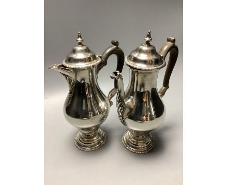 A George V silver café au lait pair of balluster form, Daniel and John Welby, London, 1912, height 21.4 cm,gross 36oz.