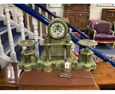 A gilt metal and onyx mantel clock garniture, height 47cm