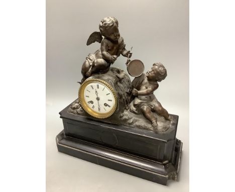 An early 20th century French spelter and slate cherub mantel clock, height 34cm