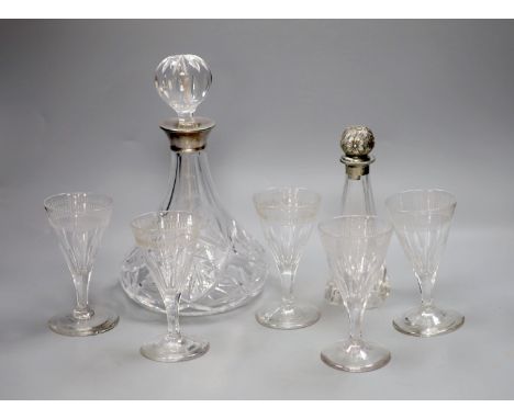 A silver collared cut glass decanter and a glass scent bottle with 800 standard silver stopper, tallest 27cm,&nbsp;&nbsp;and 