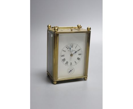 A Charles Frodsham brass cased repeating carriage clock, height 14cm with handle down