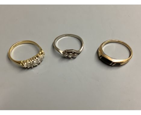 Two 18ct and diamond set rings, gross 5.7 grams and an enamelled ring (a.f.).