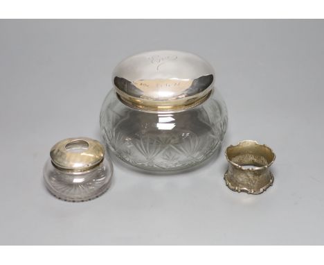 A 1920's silver mounted cut glass powder bowl, a similar small hair tidy and a silver napkin ring.