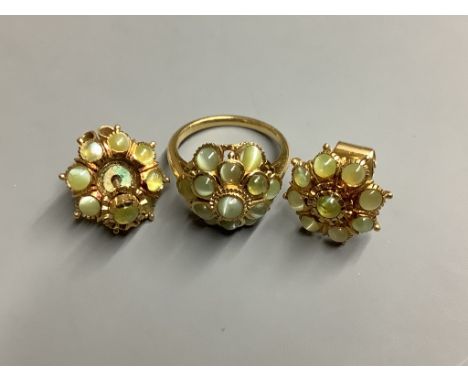 A yellow metal and cat's eye chrysoberyl? cluster ring and a pair of similar earrings,ring size M, gross weight 15.6 grams, e
