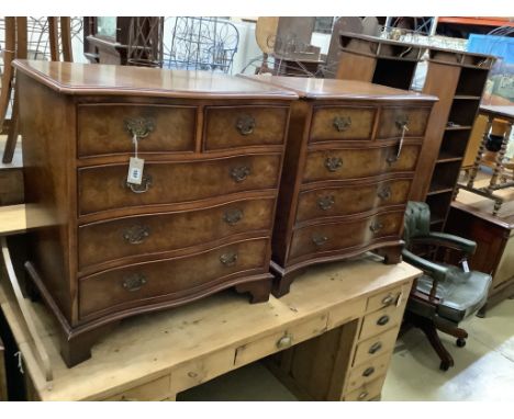 A pair of Georgian style walnut serpentine-fronted chests of drawers, of small proportions, each fitted two short drawers and