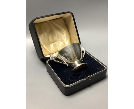 A cased Art Deco silver two handled christening bowl, Atkins Bros, Sheffield 1931, height 10 cm, 244 g, case lacking spoon.