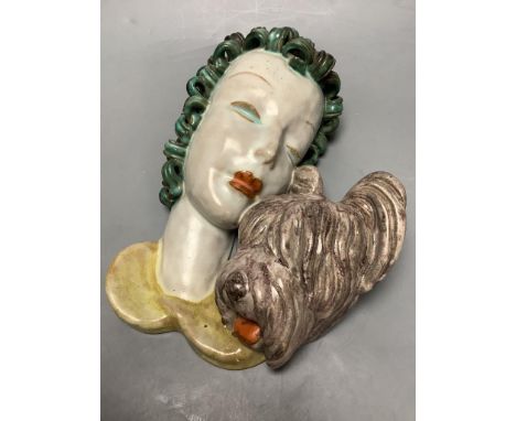 A Goldscheider portrait wall mask depicting a lady and her dog, length 25cm