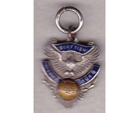 SCOTTISH 1949   Hall-marked silver medal with enamel. Wording reads "Scottish International 1949" . The badge has an Eagle on