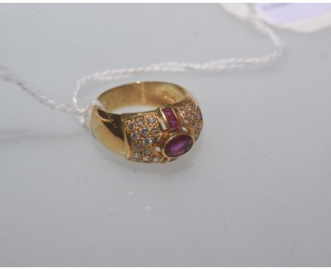 An 18ct gold mounted ruby and diamond cocktail ring, with import mark. Ring size N