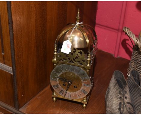 A 19th century brass lantern clock with silvered chapter ring and Roman numerals, the eight day movement signed R & C