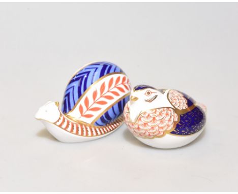 Two Royal Crown Derby paperweights, each with gold button, one a snail the other a bird (2)
