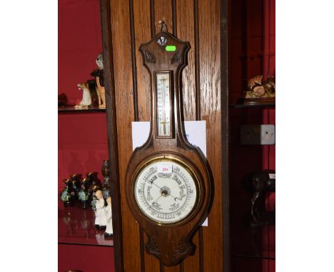 An oak cased anoroid barometer