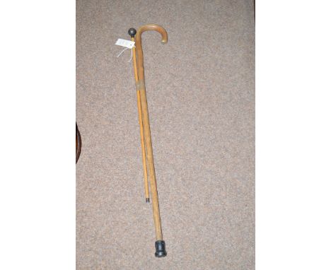 A silver mounted swagger stick; together with a wooden walking stick.  (2)