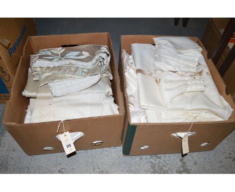 A quantity of soft goods, to include: curtains; table linen and bed linen, in two boxes.