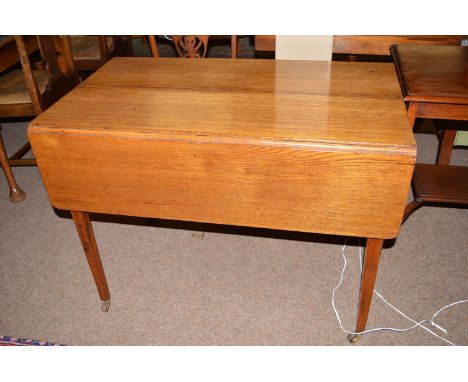 A 19th Century oak Pembroke style table, fitted a drawer with brass handle in one end frieze, raised on square tapering legs 