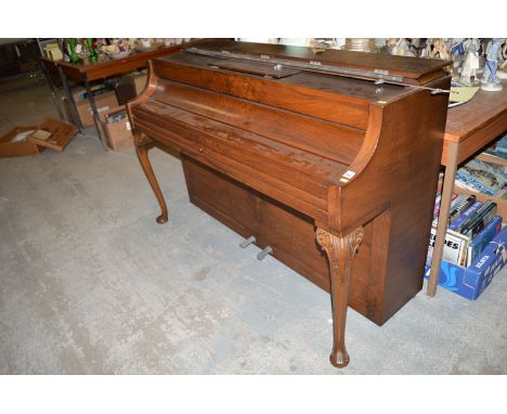 A compact overstrung iron framed piano, serial no. 840 by John Brinsmead & Sons, London, in walnut case, raised on carved cab