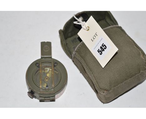 A hand-held compass finished in green, by Stanley Of London; together with a padded canvas case (dated 1979).