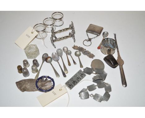 A quantity of white metal items, including: a brooch and bracelet by Georg Jensen; two knife rests; three napkin rings with m