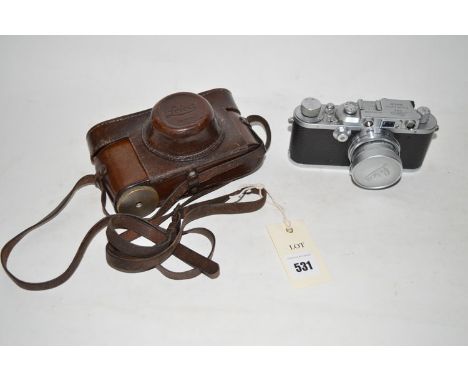 A Leica IIIA rangefinder camera, fitted a Summicron 5cms f2 collapsible lens, in brown leather case.