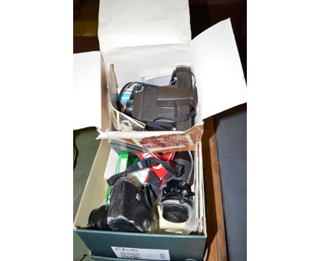 A Polaroid camera; and a Cannon AE/1 camera with accessories.